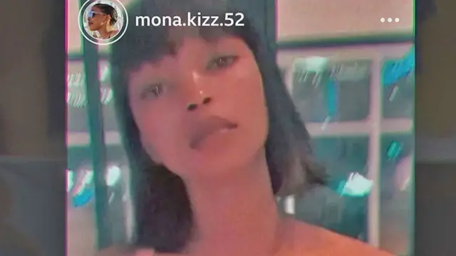 Una captura de un video de redes sociales de Monic que muestra a una mujer joven mirando a la cámara con cabello oscuro cortado recto hasta los hombros.
