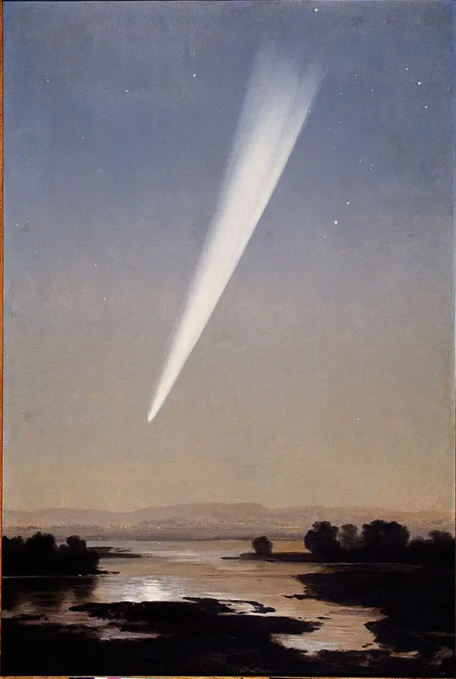 Cometa en el cielo  reflejado en lago