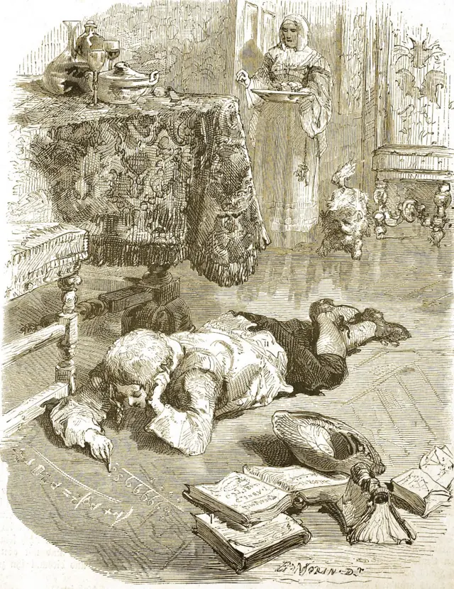 Escena con Pascal tirado en el piso, con libros a su lado, y haciendo cuentas en el suelo.