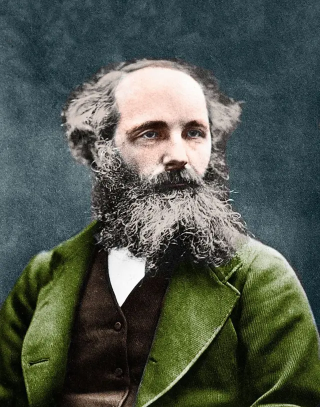 Retrato de James Clerk Maxwell (1831-1879), donde viste una chaqueta verde, tiene una larga barba y mira de lado.