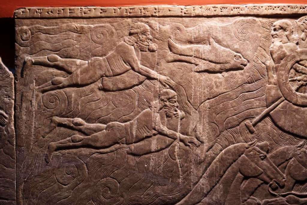 Un relieve esculpido de la antigua Mesopotamia muestra a soldados cruzando un río a nado